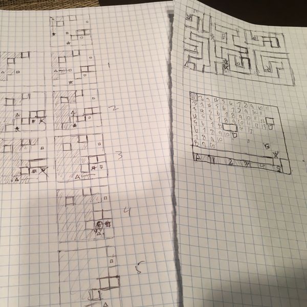 My initial paper design.  Here i'm tracking water flow to make sure a level is solvable.  In the top right you can see the map that eventually became level 4.